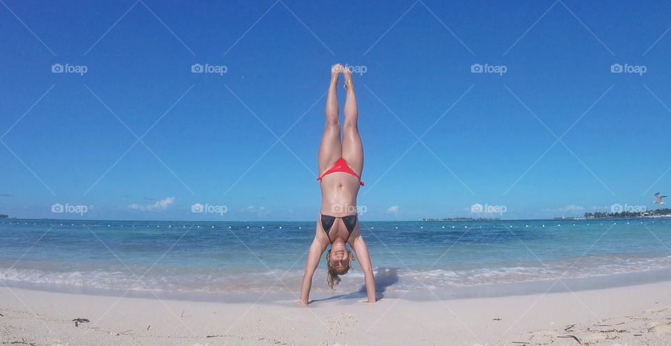 Handstand on a beach