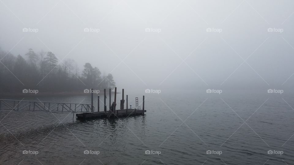 foggy morning on the lake.  view of dock.