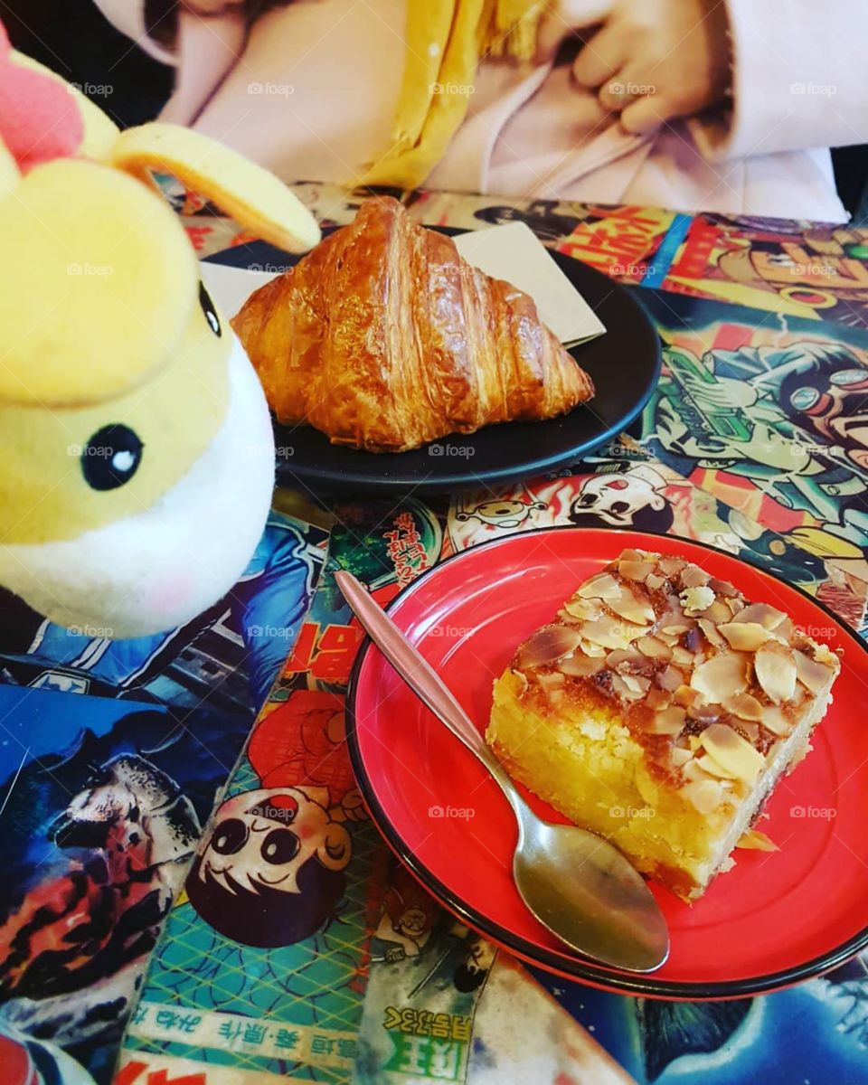 Gary the little giraffe watches as we devour a fantastic croissant and a ginger and almond slice.