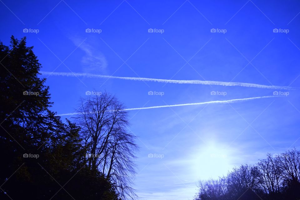 Vapour trails in the blue sky