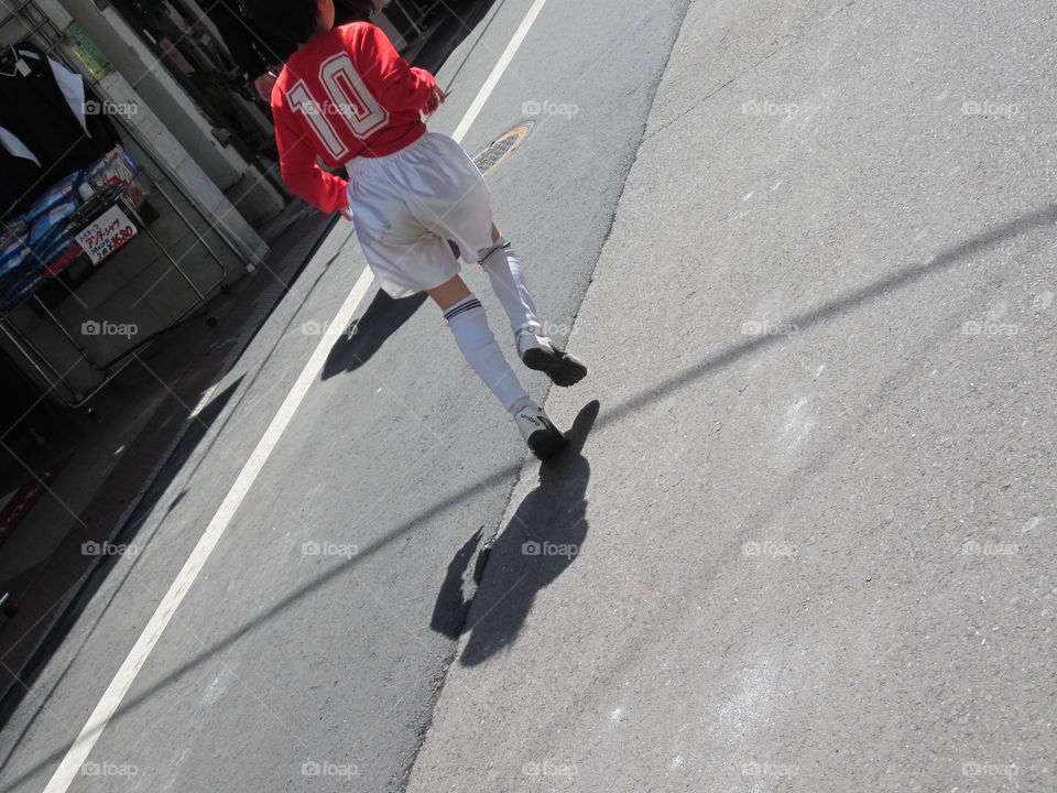 Little Japanese Boy in Soccer Football Uniform, Running in Street, Nakameguro, Tokyo, Japan