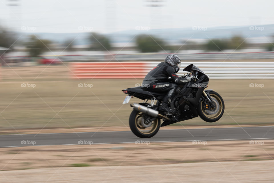 Speed motorbike doing a Wheelie