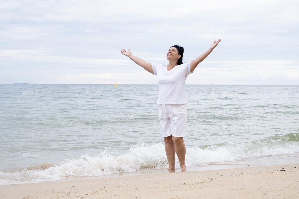 happy woman in tropical resort