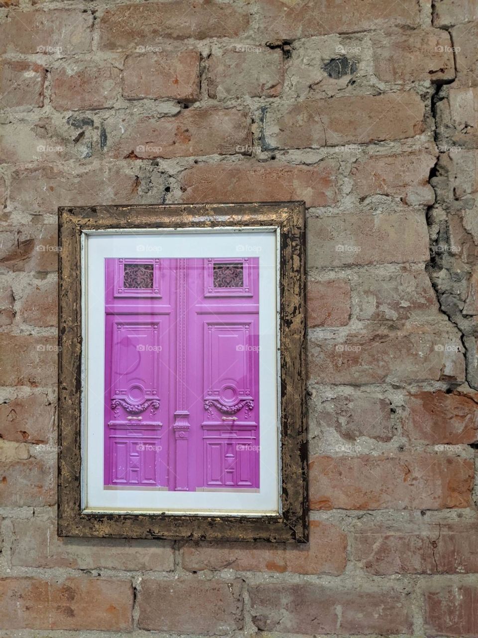 vintage purple door photo in gold frame on a brick interior wall, cracked vintage brick wall, cafe wall decor