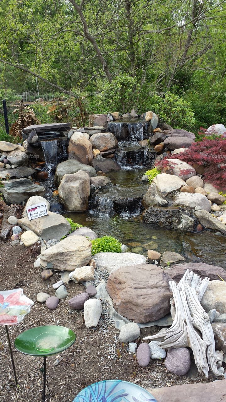 small man made waterfall and pond