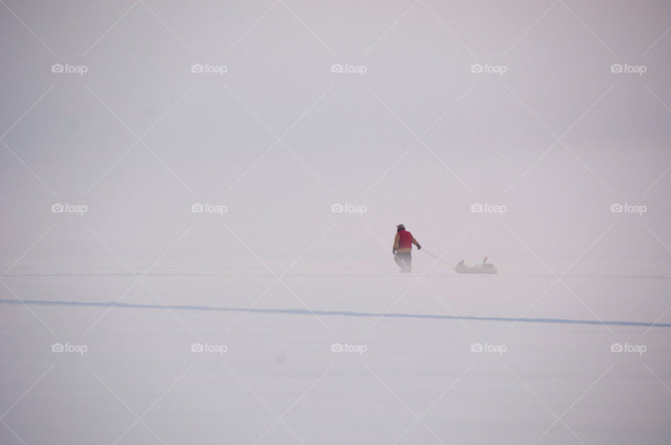 Pulling a sled across Lake Winnepesaukee to ice fish