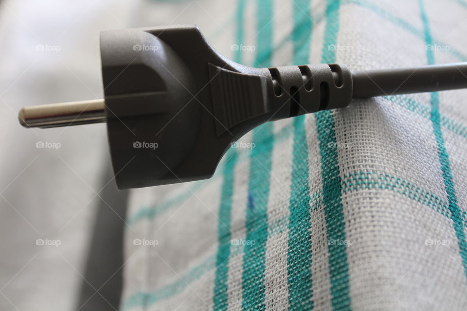 electrical cord head on a textile cloth