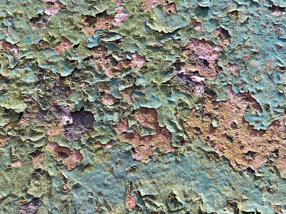 Rust and peeling paint on an old bridge