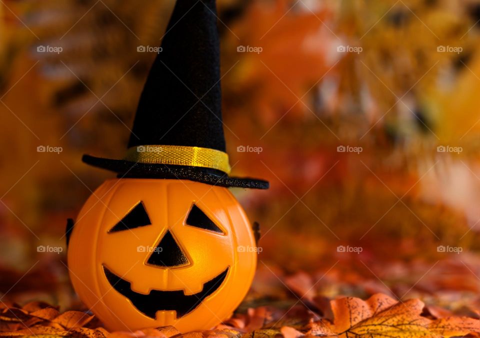 Plastic pumpkin in wide brimmed hat, Halloween table decor