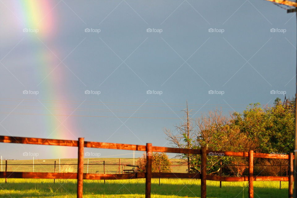 Rainbow with femce in front