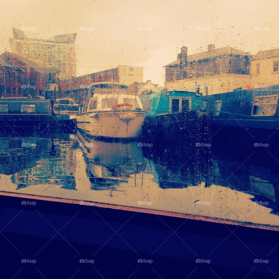Rainy day in a canal boat. Looking out the window on a rainy day, in Birmingham City centre, UK 
