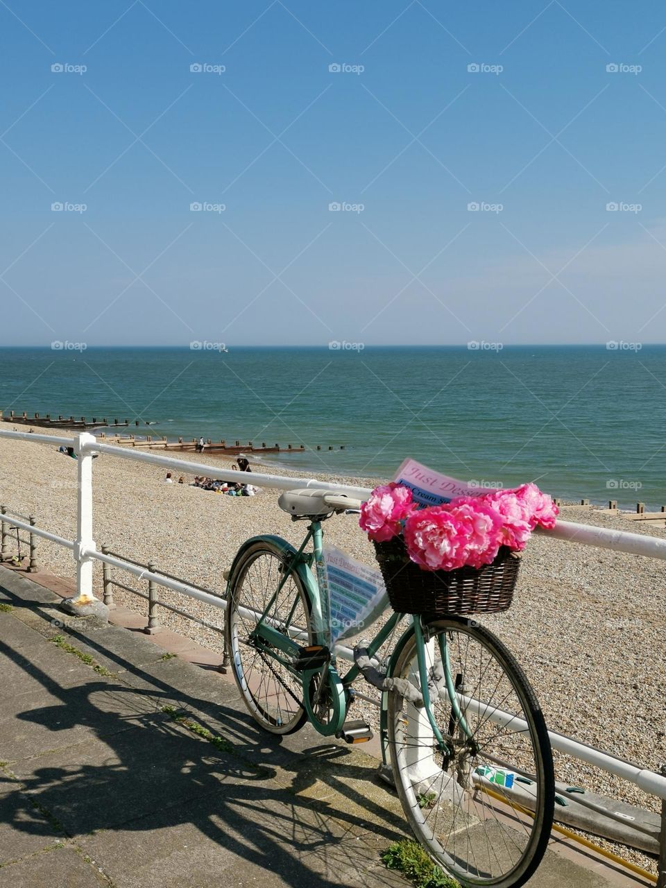 Bike on the beach. Beachfront, promenade, bike with flowers.