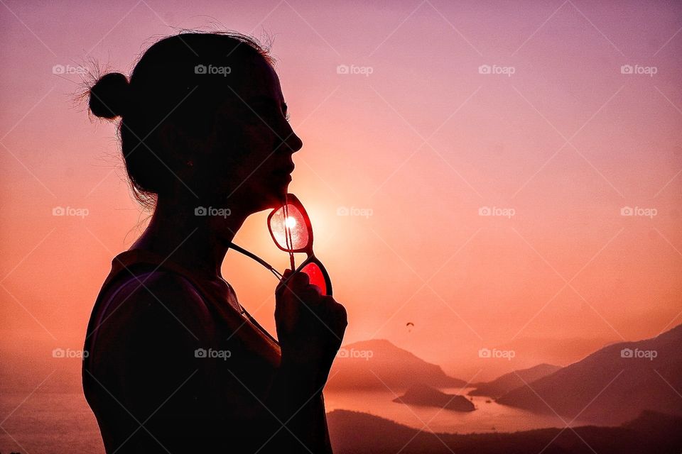 Silhouette of a girl with glasses