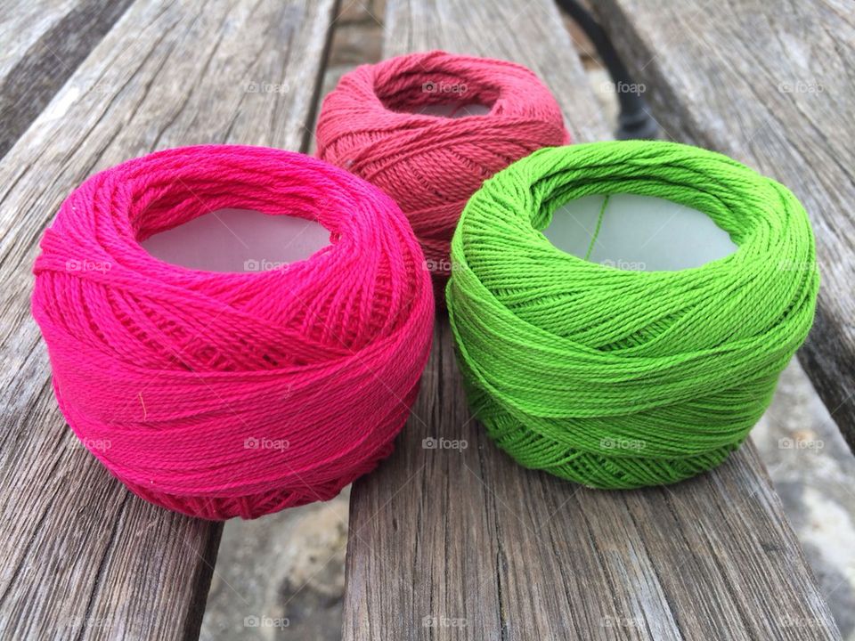 Three colourful wool balls