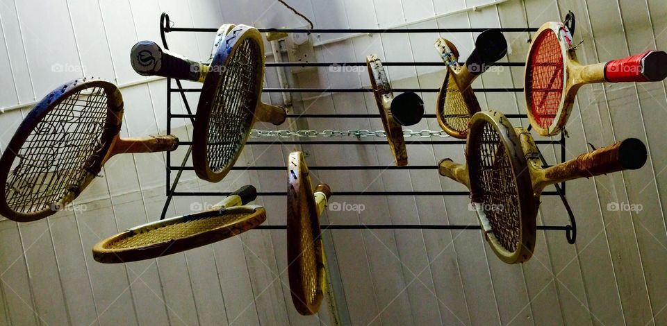 Tennis racket. Hanged old tennis racked in a flea market...