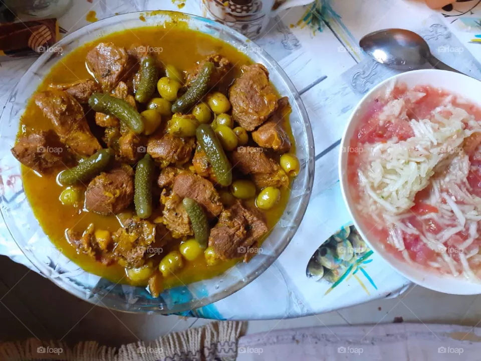 Moroccan dish of meat, olives and pickled cucumbers