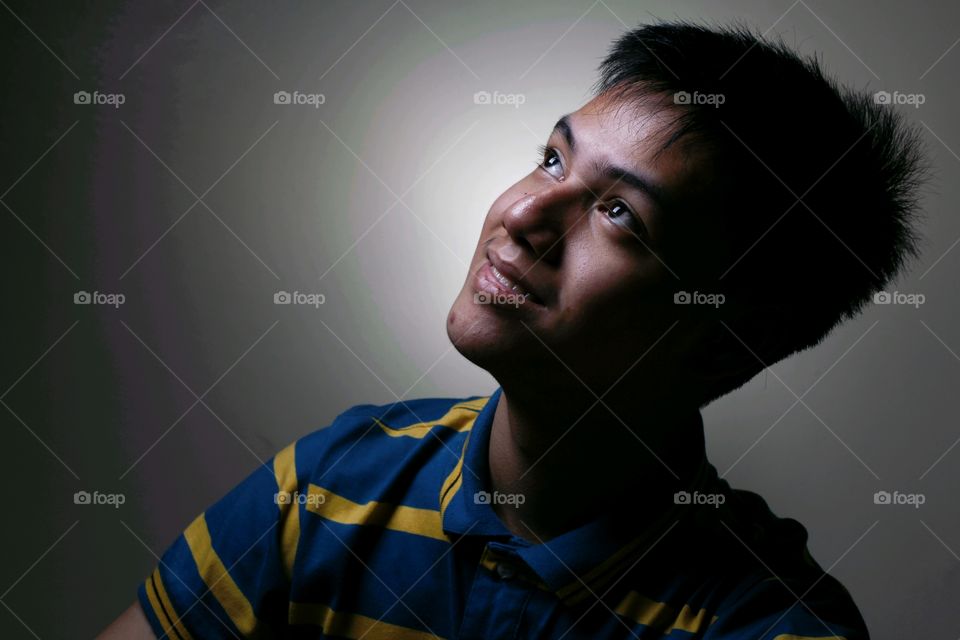 male teenager looking up