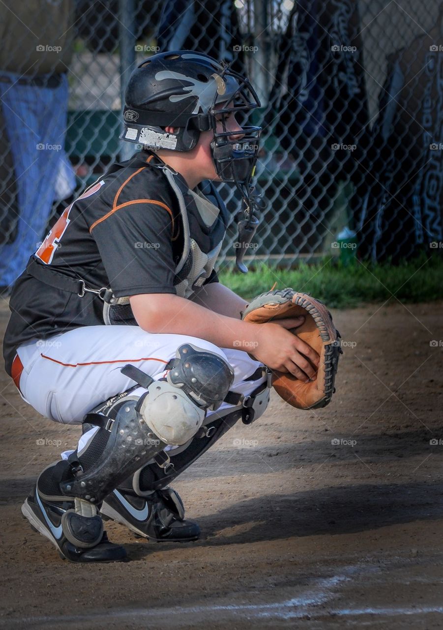 Crouching young catcher