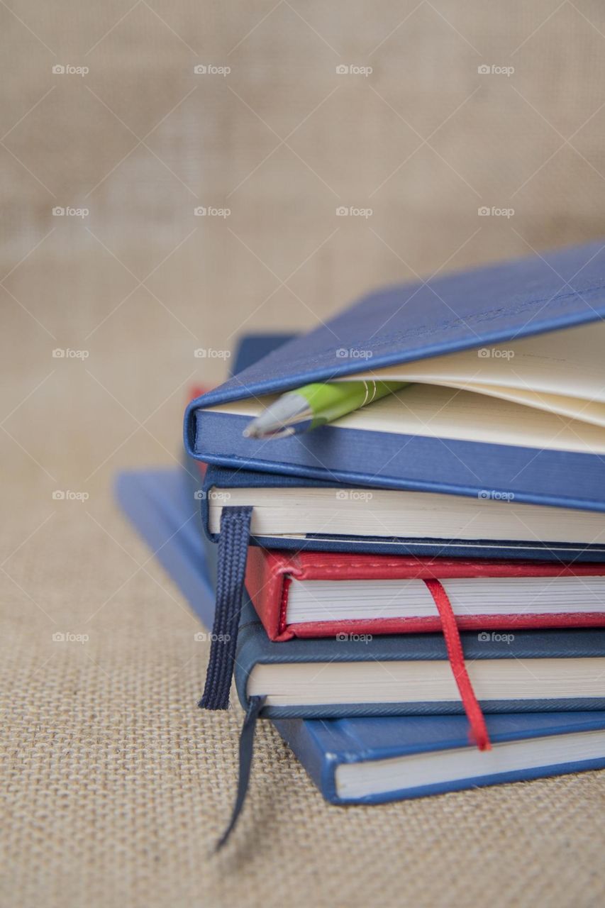 A stack of notebooks on the table. Education concept