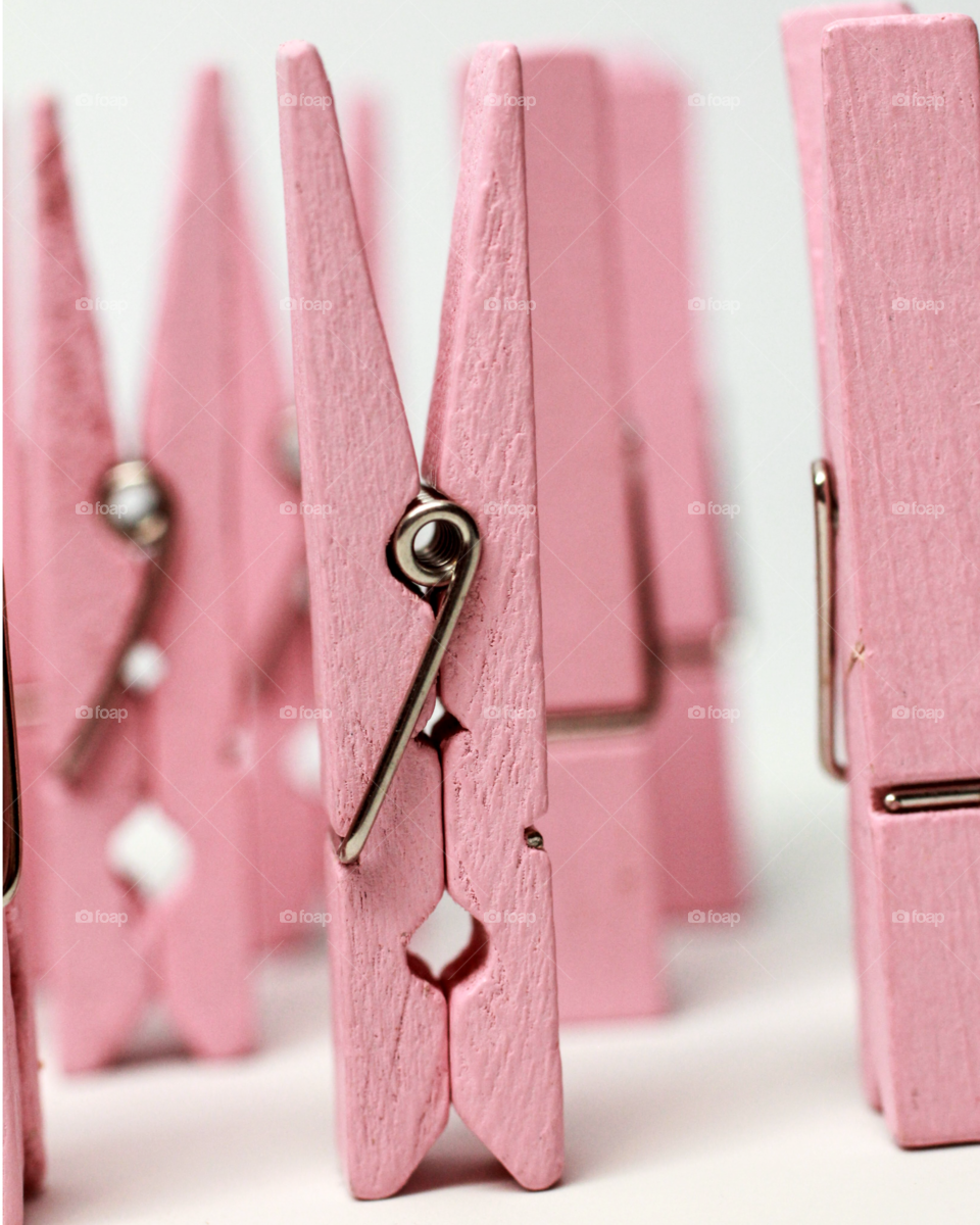 Close-up of pink wooden clothes peg