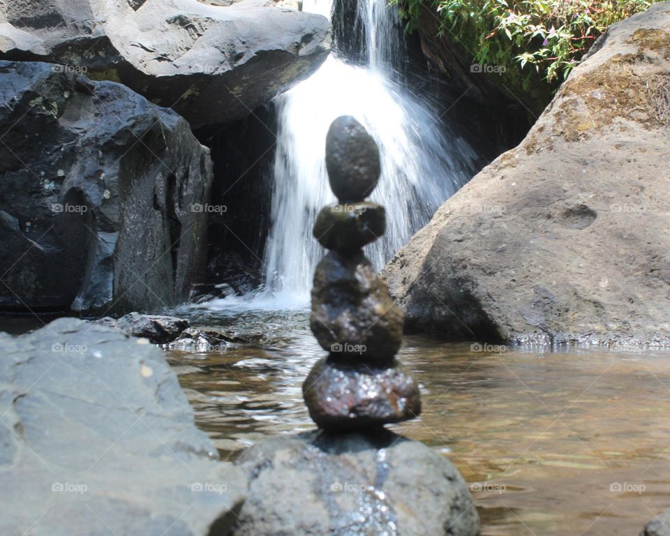 stacked stones on the river bank