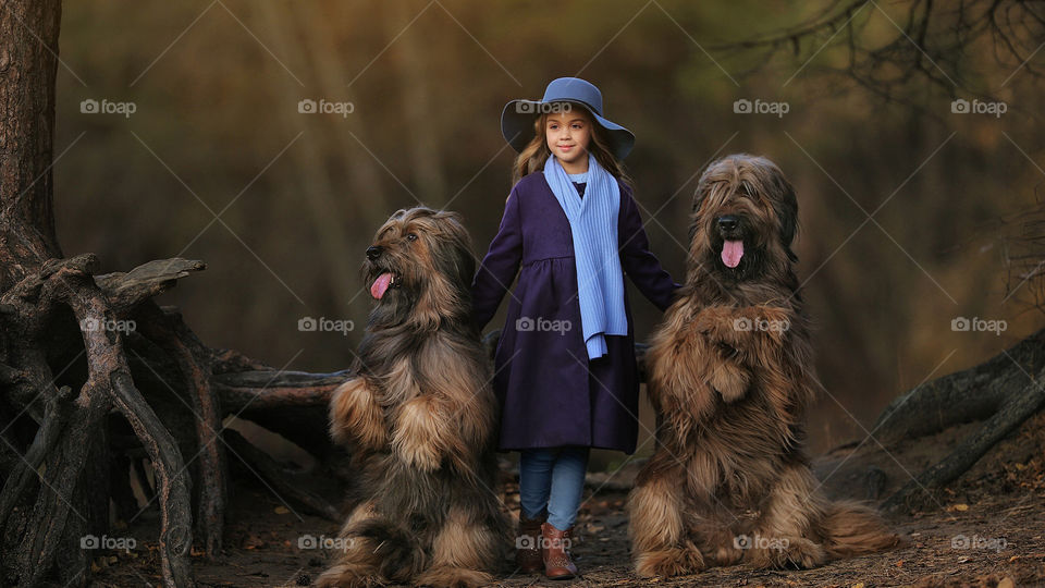 Beautiful  Image Of Girl With Two Beautiful Long Hair Dogs in a Forest.