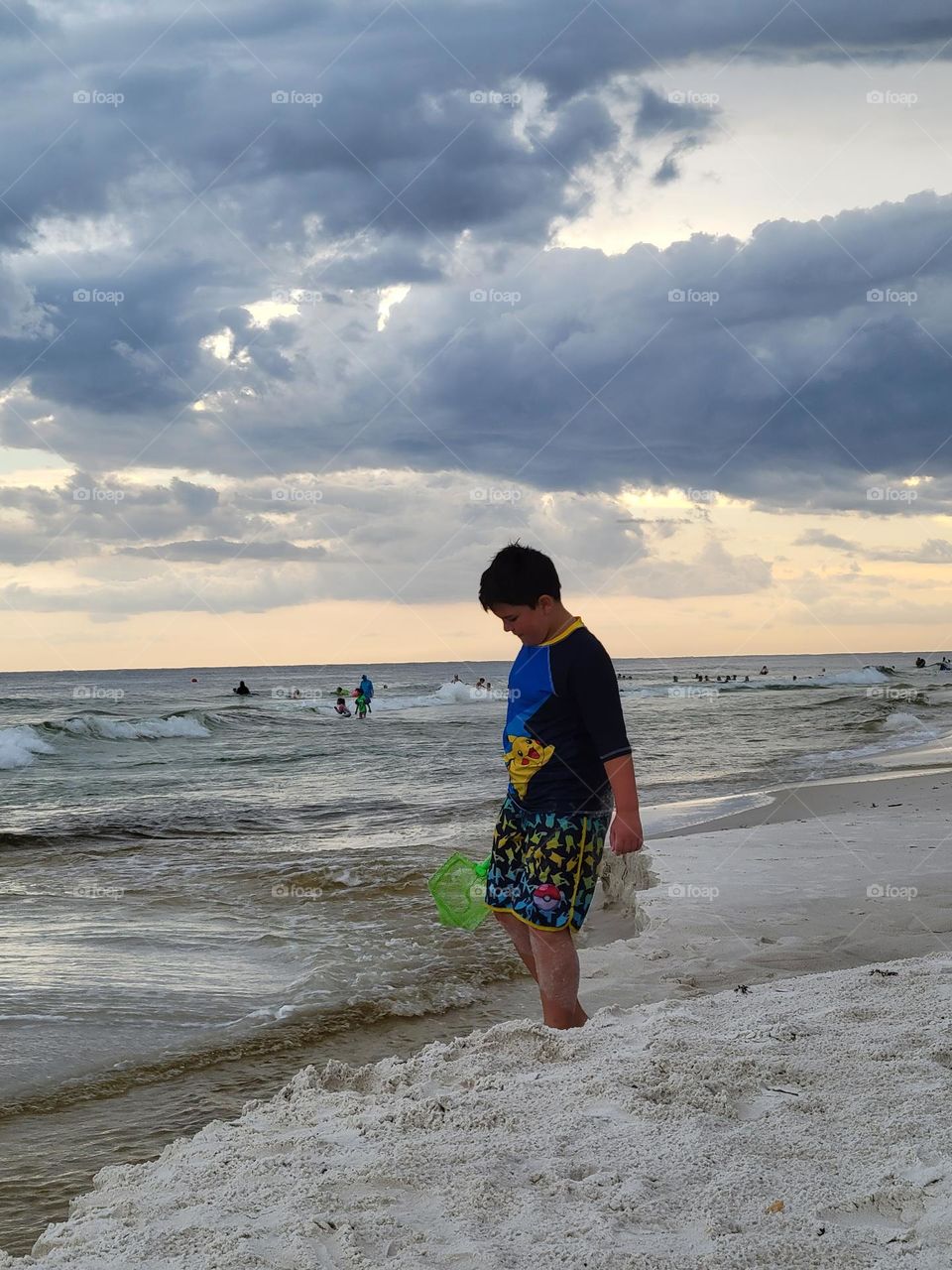 boy at beach by the ocean