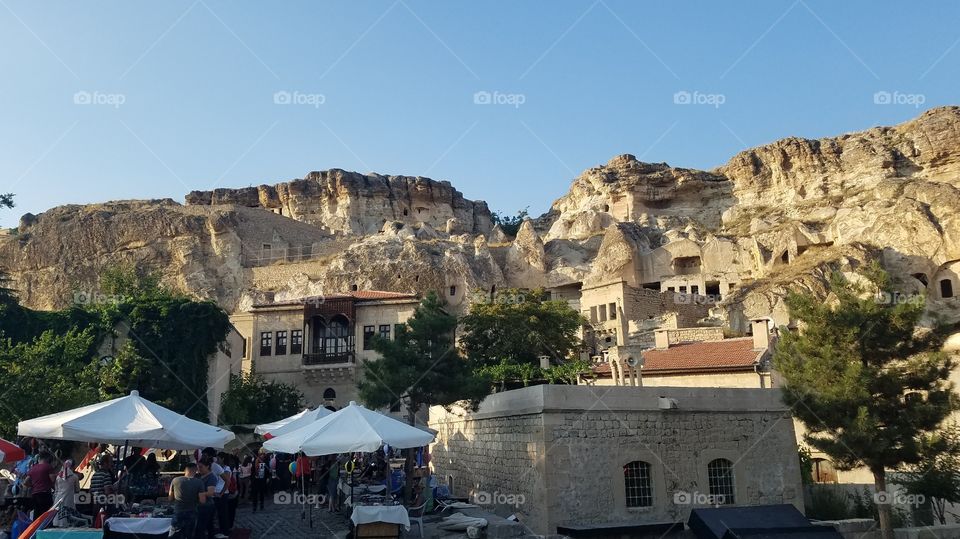 market in front of some Cappadocia rock homes