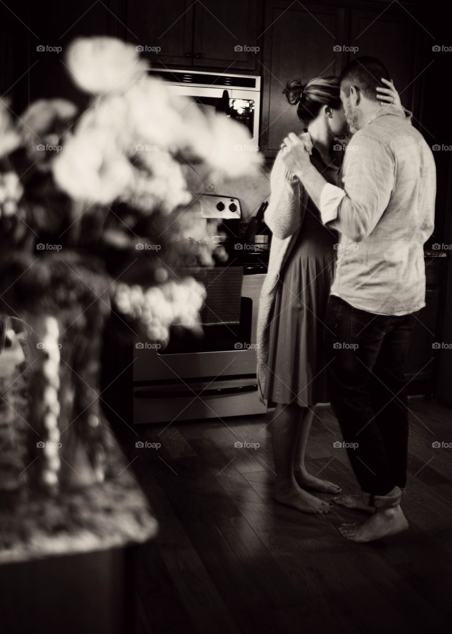 Slow dance in the kitchen in black and white