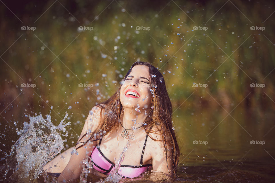 Woman enjoying in river