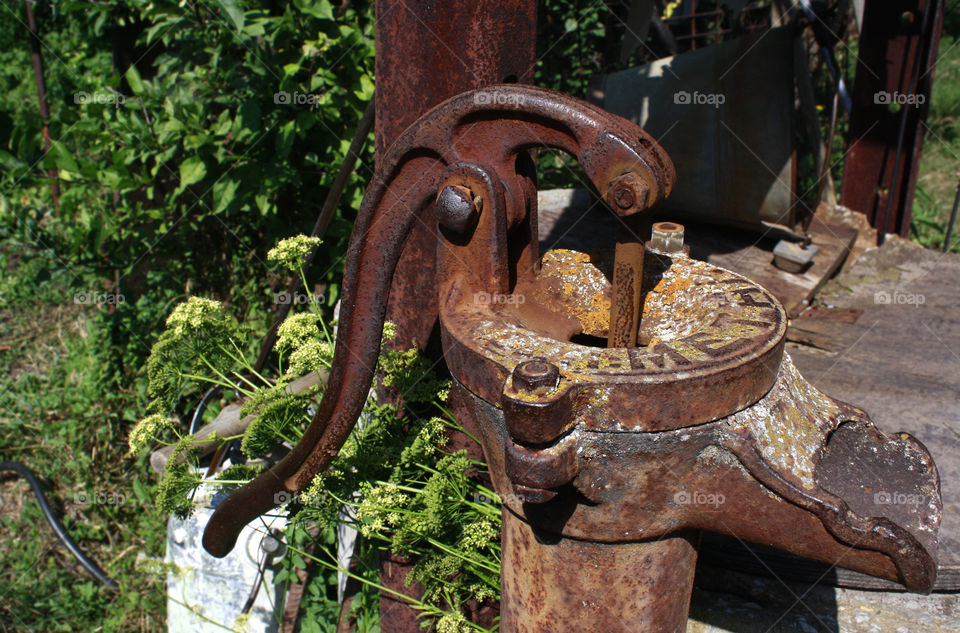 An old rusty water pump for well