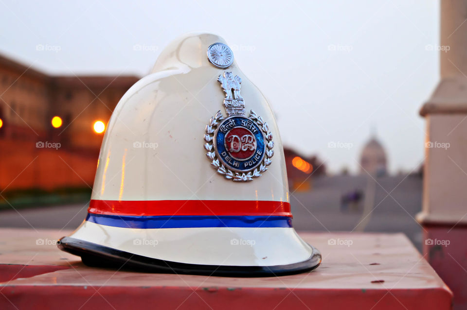 Delhi Police. A Police Hat in front of the President's House.