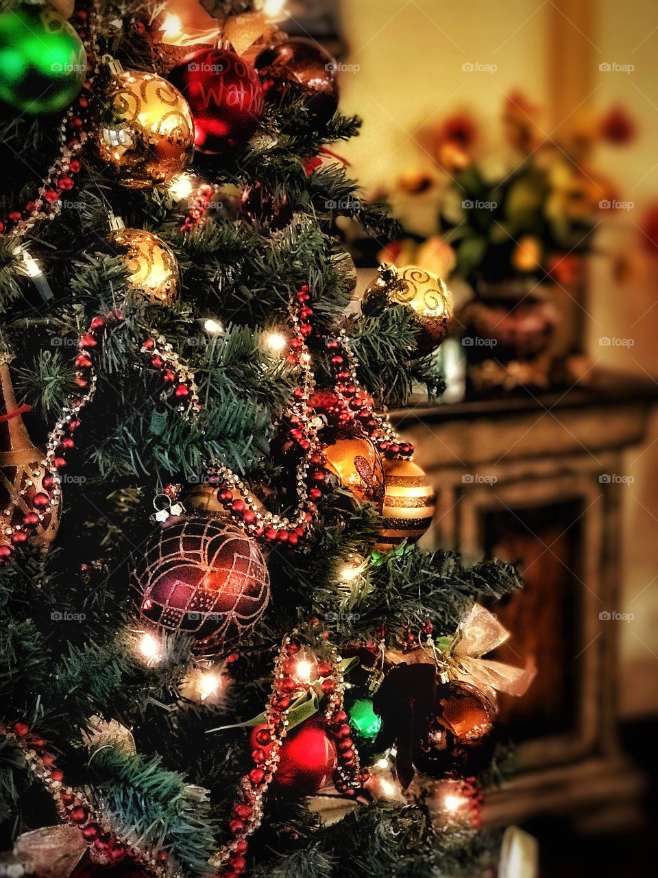 Decorated Christmas tree glows in a beautiful holiday ready room