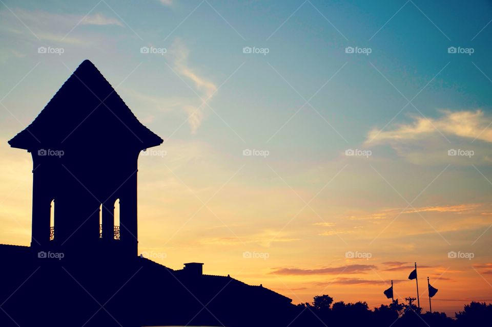 Silhouette of tower at sunset