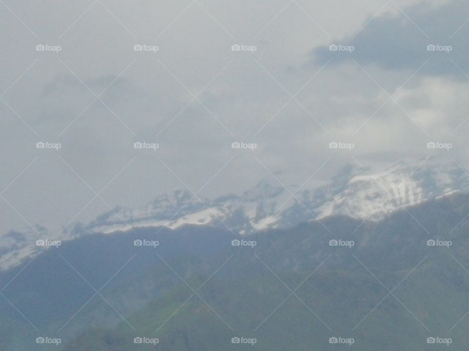 mountains covering by clouds