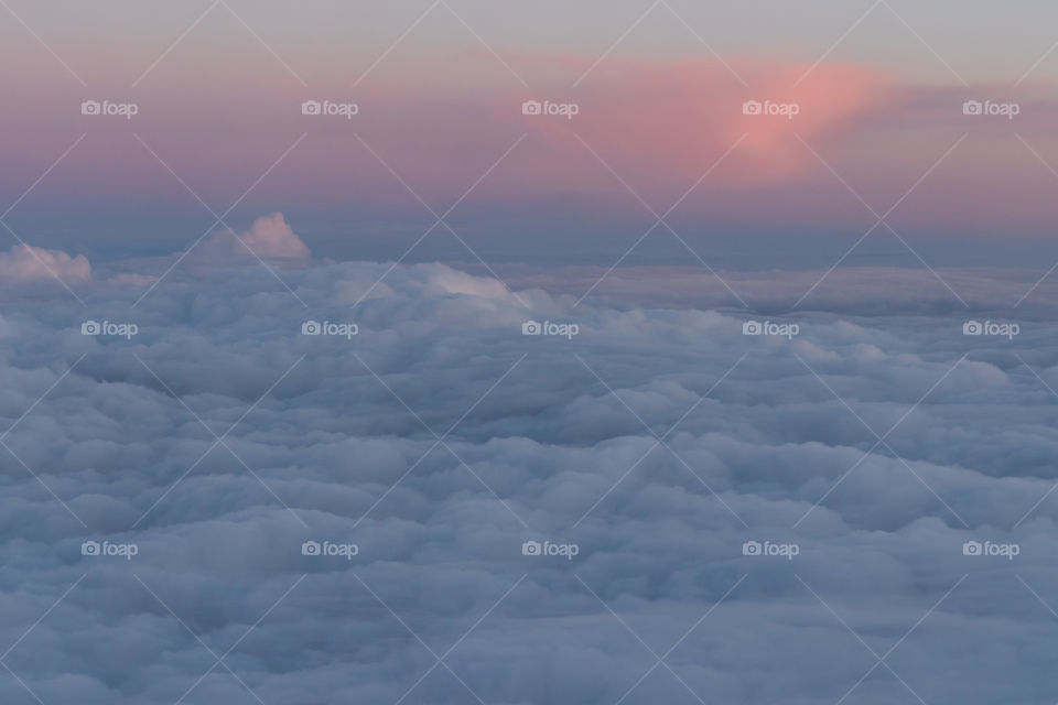 Fluffy Clouds from above at sunset during take off after my last vacation.