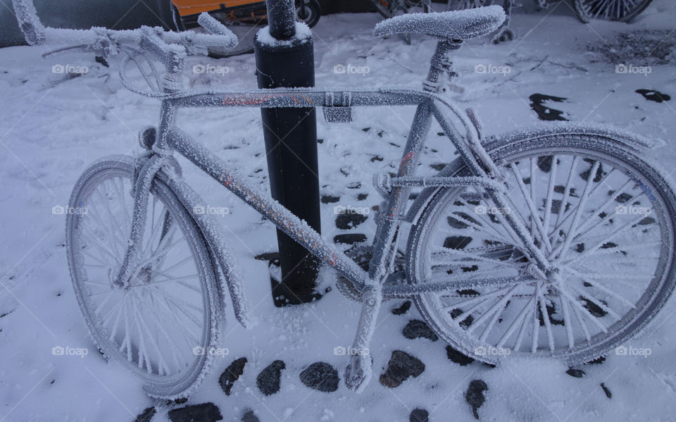 Frozen bicycle on extremely cold winter morning in Helsinki, Finland