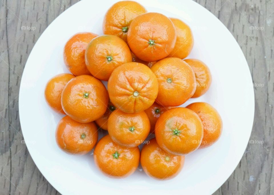 Orange fruits on plate