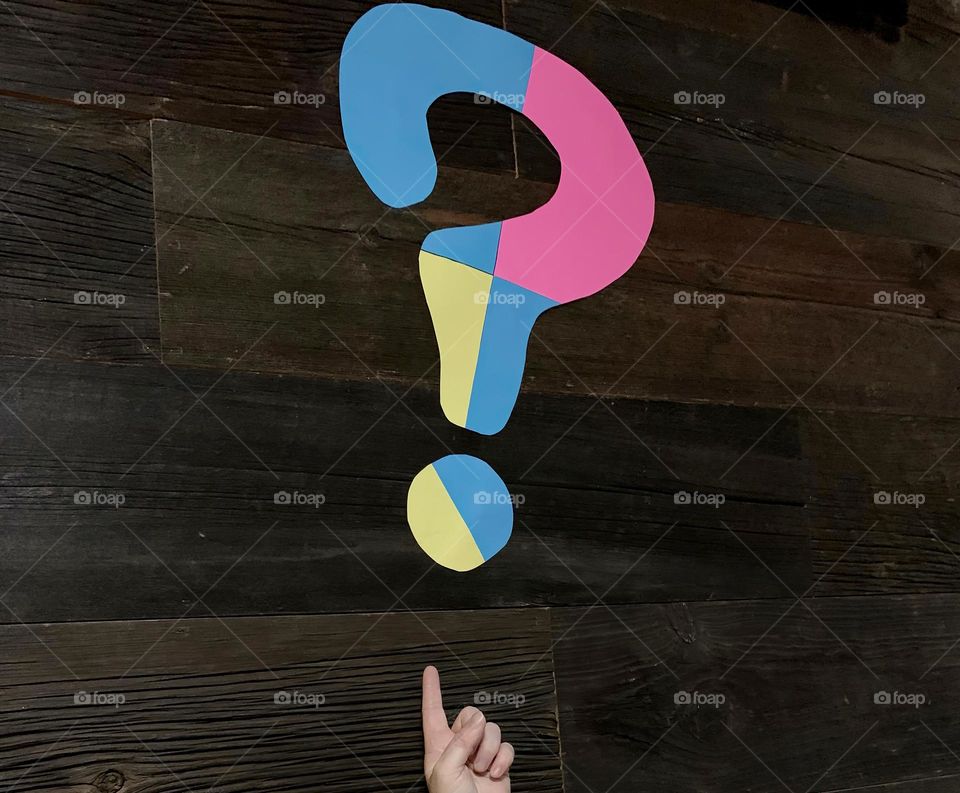 Large Colorful QUESTION MARK With Pointing Finger To Show There Is A Truly Great Questioning About Something.