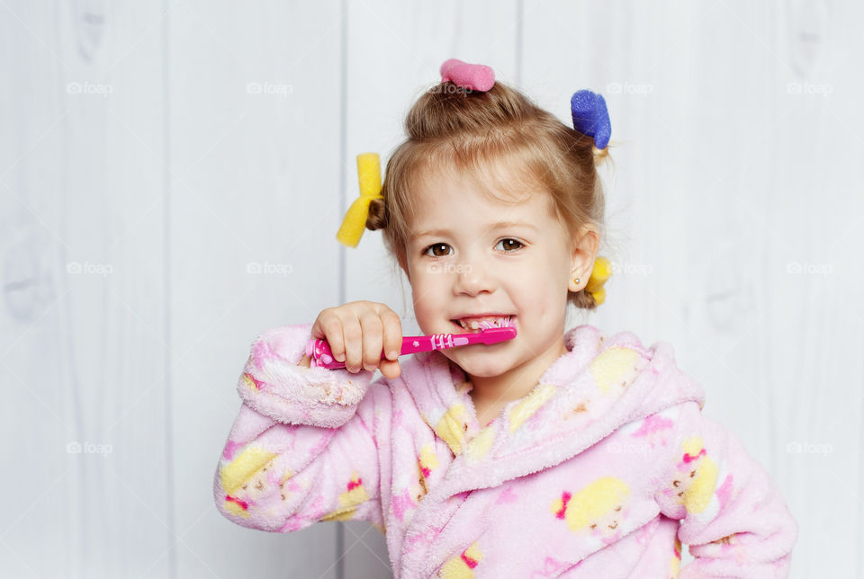 baby brushing his teeth