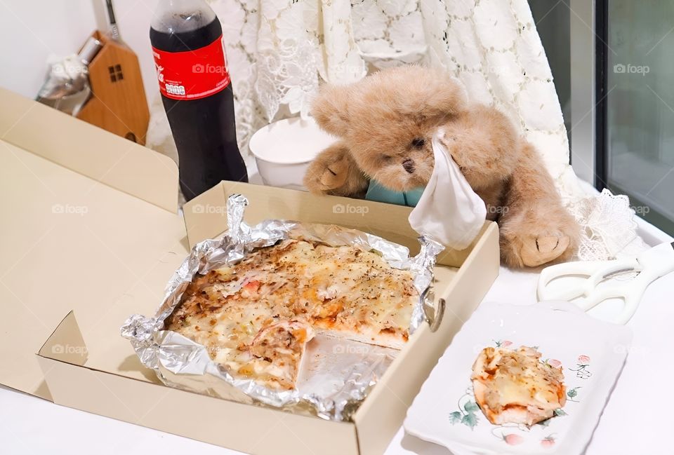 A bad bear trying to steal my pizza.