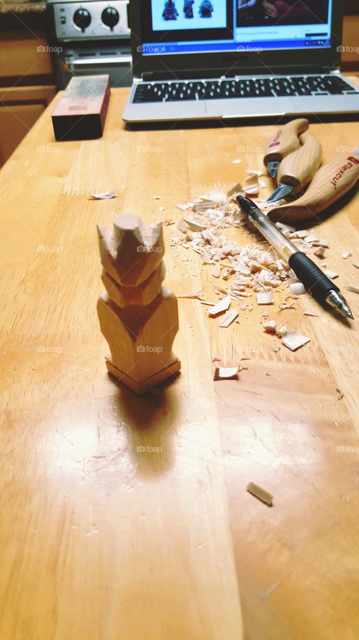 Whittling a Gundam figure from my laptop onto basswood with Flexcut knives.