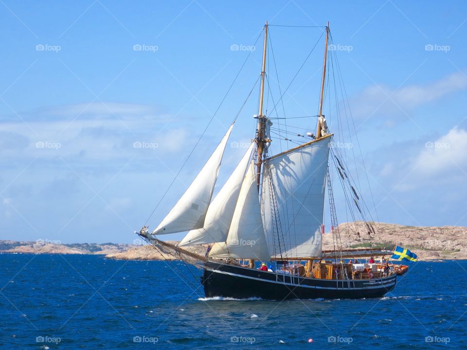 Old sailboat. Sailing wooden sailboat. 