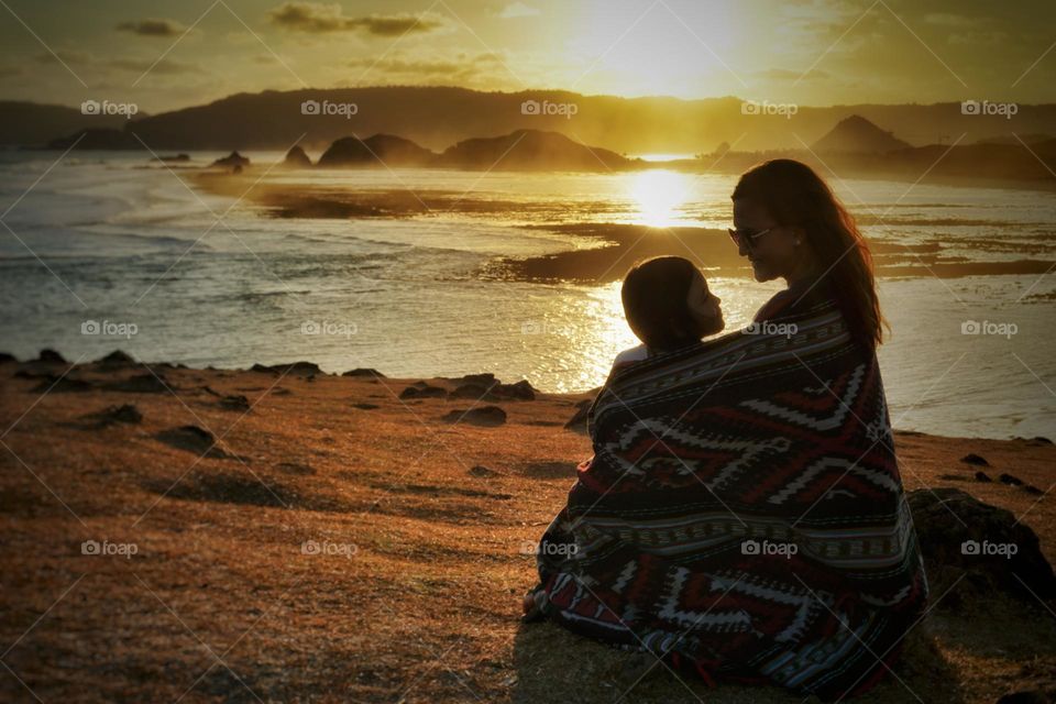 Beautiful sunset with mom and daughter