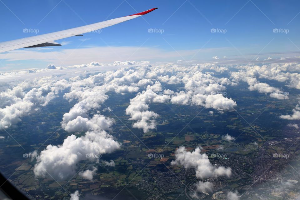 Aerial view of clouds and city