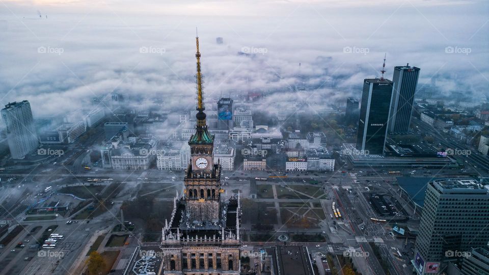 Aerial view of o Warszawa center during fog weather. Palace of Culture and Science on first sight.