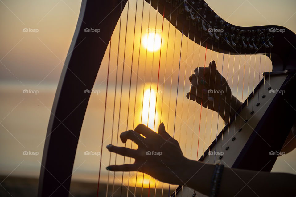Close up of Celtic harp in sunset