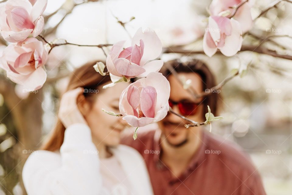 couple in magnolia garden