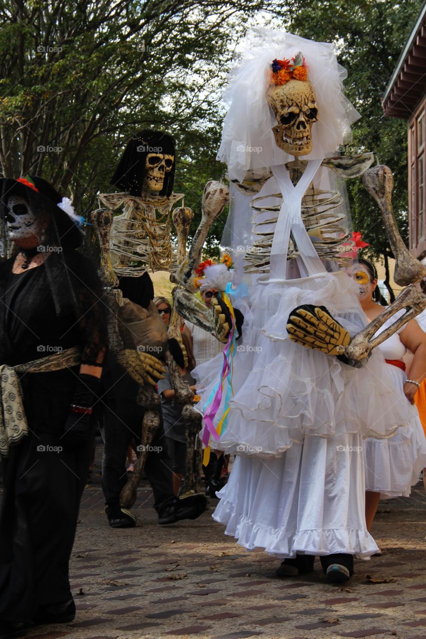 Skeletons happily march the streets in a parade for San Antonio's Día de los Muertos celebration