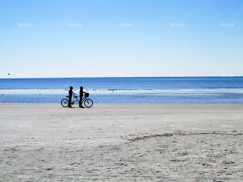 Kids on a tandem bike . Hilton head, South Carolina 